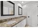 Bathroom with double sinks, granite countertop, and mirrors at 2020 Aspen Oak St, Las Vegas, NV 89134