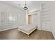 Bedroom with wood-look floors, built-in shelves, and a Murphy bed at 2020 Aspen Oak St, Las Vegas, NV 89134