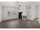 Living room with wood-look flooring, fireplace, and built-in shelving at 2020 Aspen Oak St, Las Vegas, NV 89134