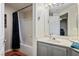 Bathroom with shower/tub, vanity, and mirror at 7107 S Durango Dr # 210, Las Vegas, NV 89113