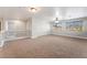 Spacious bonus room with neutral carpet and ceiling fan at 10993 Ladyburn Ct, Las Vegas, NV 89141