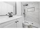 Updated bathroom with marble tile shower and modern vanity at 4134 Pequeno Ave, Las Vegas, NV 89120