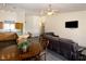 Open dining area with a wooden table and dark leather couch at 531 Hagens Aly, Mesquite, NV 89027