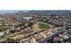 Aerial view of community with golf course and mountain views at 81 Myrtle Beach Dr, Henderson, NV 89074