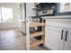 Kitchen with pull-out drawers, wood shelving and stainless steel appliances at 9637 Blue Bell Dr, Las Vegas, NV 89134