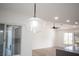 Glass pendant light fixture above kitchen island at 9637 Blue Bell Dr, Las Vegas, NV 89134