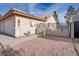 Home's exterior showcasing a gated entry and walkway at 134 Skytop Dr, Henderson, NV 89015