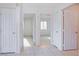 Hallway with tile flooring and access to bedrooms at 134 Skytop Dr, Henderson, NV 89015