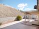 Back patio area with desert landscaping and hillside view at 1920 Racine Dr, Las Vegas, NV 89156