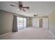 Spacious primary bedroom with double ceiling fans, large windows, and walk-in closet at 4065 W Maulding Ave, Las Vegas, NV 89139