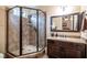 Clean bathroom with a walk-in shower and a granite vanity at 7110 Crowntop Cir, Las Vegas, NV 89118