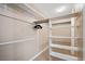 Large walk-in closet with shelving and hanging rods at 9404 Low Tide Ct, Las Vegas, NV 89117