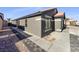 Single-story home with gray exterior and a paved walkway at 2617 Early Vista St, Las Vegas, NV 89142