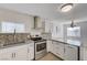 Bright kitchen boasting stainless steel appliances and a stylish backsplash at 310 Jackson Ave, Las Vegas, NV 89106