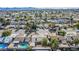 Aerial view showing the house and surrounding neighborhood with mountain views at 4100 Springhill Ave, Las Vegas, NV 89121