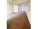 Spacious living room with neutral carpeting and lots of natural light at 59 E Agate Ave # 205, Las Vegas, NV 89123