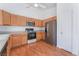 Kitchen with stainless steel appliances and light wood cabinets at 9621 Bandera Creek Ave, Las Vegas, NV 89148