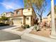 Beautiful two-story home with attached garage at 9390 Cowboy Rain Dr, Las Vegas, NV 89178