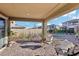 Relaxing backyard patio with seating and a putting green at 12429 Alpenglow Ct, Las Vegas, NV 89138