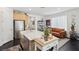 Modern kitchen with island, stainless steel appliances, and light wood cabinets at 12429 Alpenglow Ct, Las Vegas, NV 89138