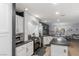 Modern kitchen with white cabinets, granite countertops, and gas stove at 10881 Pentland Downs St, Las Vegas, NV 89141