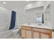 Main bathroom with a double vanity and bathtub at 2885 Timber Country Rd, North Las Vegas, NV 89086