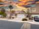 One-story home with stone accents and a two-car garage at 3187 Castle Canyon Ave, Henderson, NV 89052