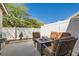 Relaxing backyard patio with fire pit and seating area, perfect for outdoor entertaining at 10407 Madagascar Palm St, Las Vegas, NV 89141