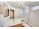 Bathroom with single sink, large mirror, and bathtub at 3524 Round Valley Way, Las Vegas, NV 89129