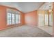 Spacious living room with carpeted floors and large window at 3524 Round Valley Way, Las Vegas, NV 89129