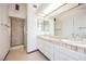 Main bathroom with double sinks, shower and tile at 3949 Weybridge Dr, Las Vegas, NV 89121