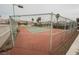 Community tennis court with chain link fence at 3949 Weybridge Dr, Las Vegas, NV 89121