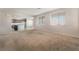 Spacious living room with carpet, open floor plan, and kitchen view at 4212 Seclusion Bay Ave, North Las Vegas, NV 89081