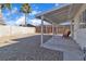 Spacious backyard with gravel landscaping and a wooden fence at 4306 Swandale Ave, Las Vegas, NV 89121