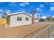 Side view of the home showcasing the yard and landscaping at 4306 Swandale Ave, Las Vegas, NV 89121