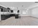 Open concept kitchen featuring dark cabinetry and an island at 4306 Swandale Ave, Las Vegas, NV 89121