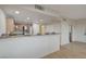 Kitchen with breakfast bar, stainless steel appliances, and light wood cabinets at 50 Aura De Blanco St # 17101, Henderson, NV 89074