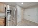 Kitchen features stainless steel appliances and wood-look tile floors at 50 Aura De Blanco St # 17101, Henderson, NV 89074