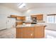 Granite countertop kitchen with oak cabinets and island at 5408 Sweet Shade St, Las Vegas, NV 89130