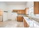 Kitchen with granite countertops and oak cabinets at 5408 Sweet Shade St, Las Vegas, NV 89130