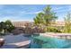 Relaxing pool area with stone bridge and mountain views at 8 Rue Mediterra Dr, Henderson, NV 89011