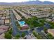 Aerial view of community with pool and green space at 11485 Vibrant Heights Dr # 32, Las Vegas, NV 89135