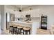 Modern white kitchen with stainless steel appliances and an island at 1163 Blossom Point St, Las Vegas, NV 89135