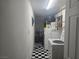 Laundry room with washer, dryer and a checkerboard floor at 1925 Franklin Ave, Las Vegas, NV 89104