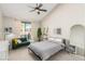 Bright bedroom with a queen bed, and access to a private patio at 2528 Laconia Ave, Las Vegas, NV 89121