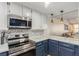 Modern kitchen with stainless steel appliances and white cabinets at 2528 Laconia Ave, Las Vegas, NV 89121