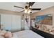 Cozy bedroom with TV, dresser, and ceiling fan at 1708 Crest Ave, Las Vegas, NV 89119