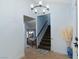 Inviting entryway with staircase, tile flooring, and modern chandelier at 1708 Crest Ave, Las Vegas, NV 89119