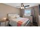 Comfortable bedroom with floral bedding and ceiling fan at 1708 Crest Ave, Las Vegas, NV 89119