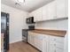 Modern kitchen with white cabinets and black appliances at 3045 Cedar St, Las Vegas, NV 89104